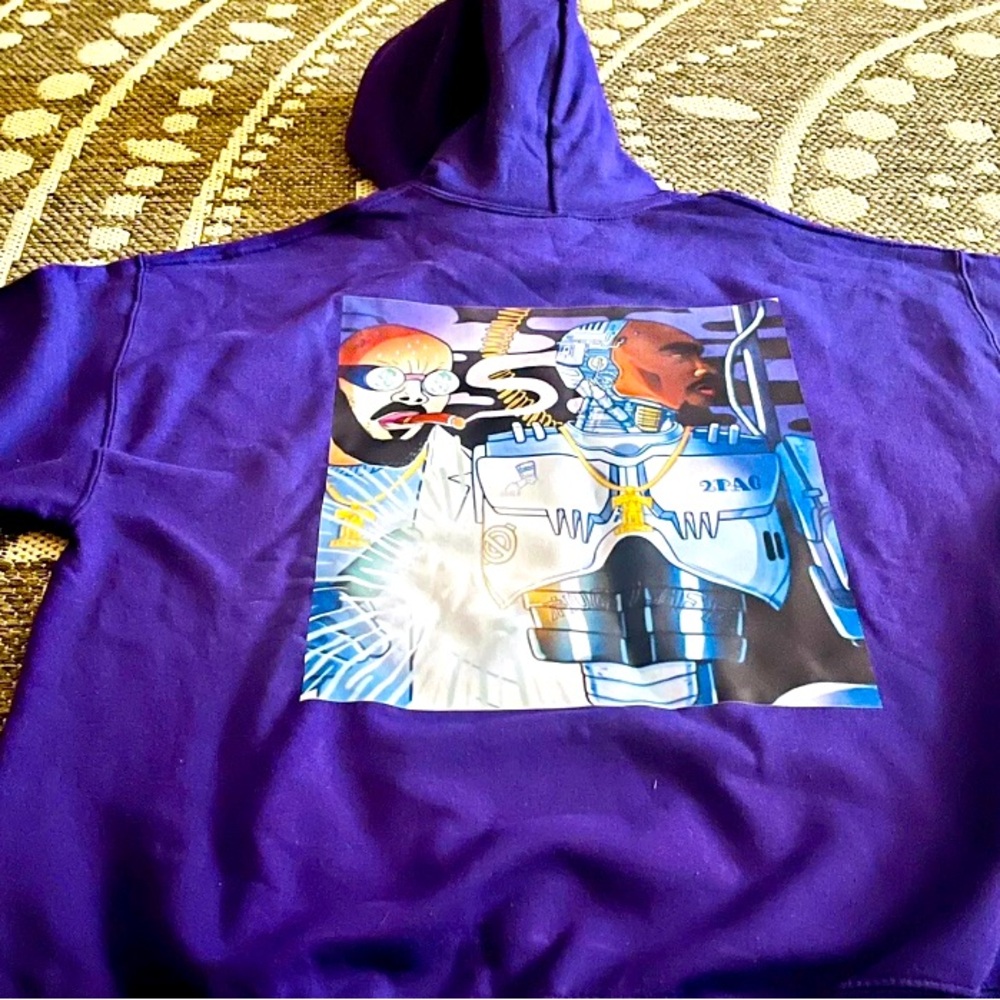Stay warm and stylish with this purple Tupac hoodie.